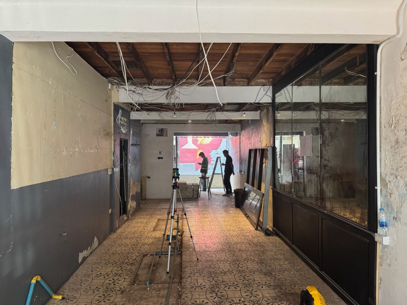 The ground floor stripped back, with exposed wiring
