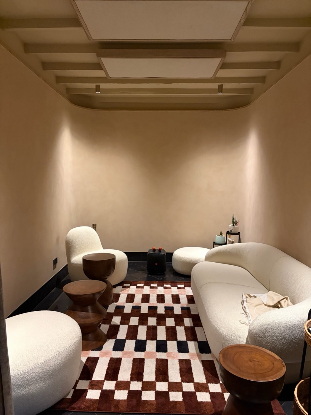 The karaoke room with curved white sofas